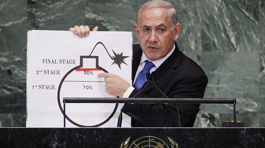 Israel's Prime Minister Benjamin Netanyahu points to a red line he has drawn on a graphic of a bomb used to represent Iran's nuclear program as he addresses the 67th United Nations General Assembly at the U.N. Headquarters in New York, September 27, 2012. The red line he drew represents a point where he believes, the international community should tell Iran that they will not be allowed to pass without intervention. REUTERS/Lucas Jackson (UNITED STATES - Tags: POLITICS) - RTR38I72