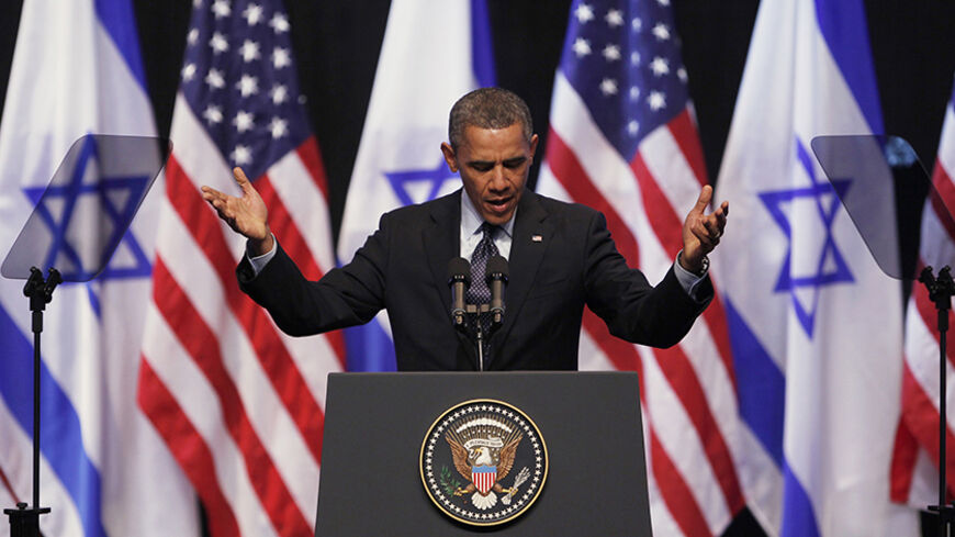 U.S. President Barack Obama gestures during his address to Israeli students at the International Convention Center in Jerusalem March 21, 2013. Obama appealed directly on Thursday to the Israeli people to put themselves in the shoes of stateless Palestinians and recognise that Jewish settlement activity in occupied territory hurts prospects for peace. REUTERS/Baz Ratner (JERUSALEM - Tags: POLITICS TPX IMAGES OF THE DAY) - RTR3FA5I