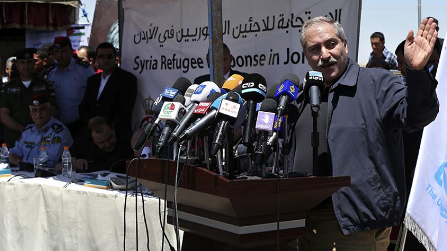 Jordan's Foreign Minister Nasser Judeh speaks during his joint news conference with Jordanian Minister of Interior Hussein Al-Majali and United Nations High Commissioner for Refugees (UNHCR) representative to Jordan Andrew Harper to officially announce the opening of the new Azraq Syrian Refugee camp near Al Azraq, east of Amman, April 30, 2014. Azraq Refugee Camp received the first group of Syrians and its divided into 12 villages with a holding capacity of 5 to 15,000 people per village, in a total land a