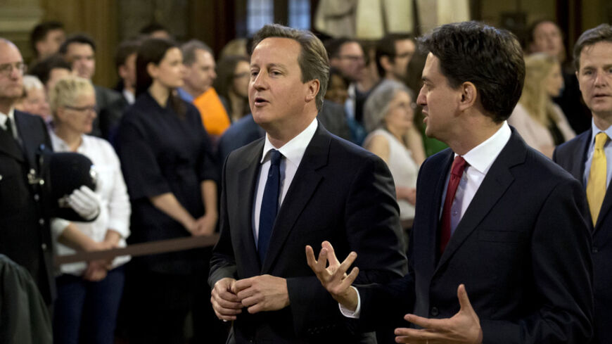 Britain's Prime Minister David Cameron (C) and Ed Miliband (2nd R), the leader of the opposition Labour Party, and Deputy Prime Minister Nick Clegg (R) arrive to listen to Queen Elizabeth deliver her speech in the House of Lords, during the State Opening of Parliament at the Palace of Westminster in London  June 4, 2014.   REUTERS/Matt Dunham/Pool    (BRITAIN - Tags: ENTERTAINMENT POLITICS SOCIETY ROYALS) - RTR3S5AV