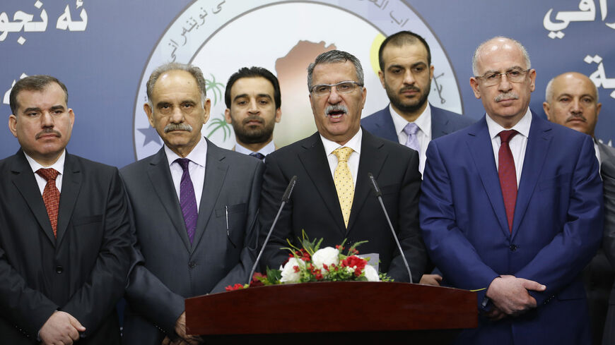 Dhafer al-Ani (C), a prominent Sunni Arab lawmaker, speaks during a news conference by members of Sunni political bloc Mutahidoon after the first session of the Iraqi Parliament in Baghdad, July 1, 2014. Sunnis and Kurds walked out of the first session of Iraq's new parliament on Tuesday after Shi'ites failed to name a prime minister to replace Nuri al-Maliki, dimming any prospect of an early national unity government to save Iraq from collapse. Parliament is not likely to meet again for at least a week, le