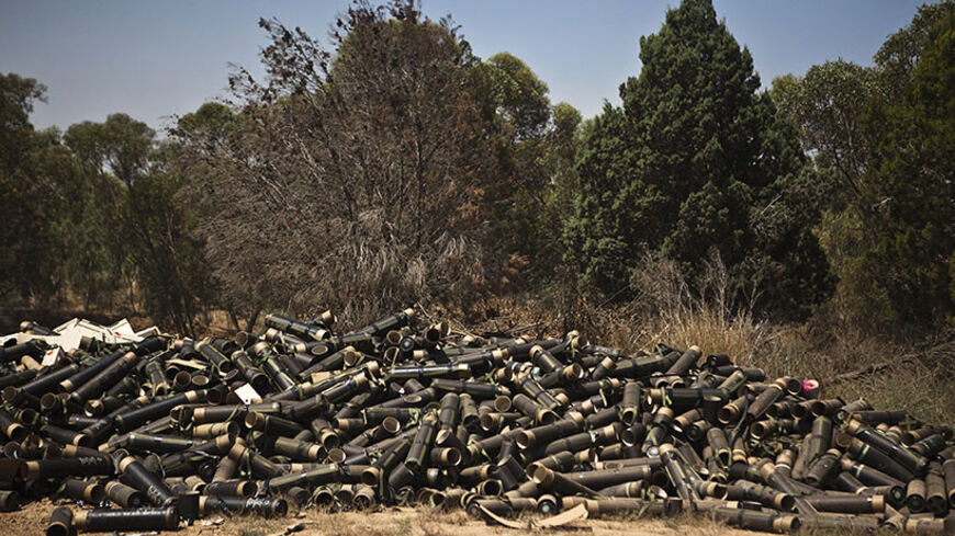 Mortar cases are piled at a military staging area near the border with the Gaza Strip July 24, 2014. Israel won a partial reprieve from the economic pain of its Gaza war on Thursday with the lifting of a U.S. ban on commercial flights to Tel Aviv, as fighting pushed the Palestinian death toll over 700. A truce between the Jewish state and Hamas Palestinian fighters remained elusive despite intensive mediation bids. Palestinians said residents of two southern villages were trapped by days of tank shelling, w
