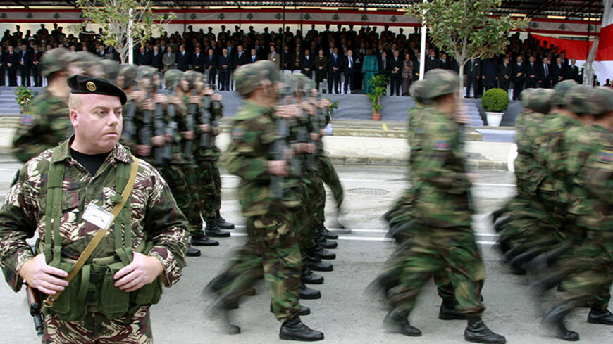 Lebanese army soldiers march during a military parade to celebrate the 65th anniversary of Lebanon's independence day in downtown Beirut November 22,2008.      REUTERS/Jamal Saidi      (LEBANON) - RTXAUIN