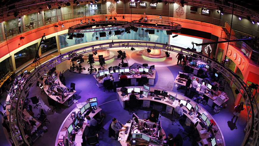 A general view shows the newsroom at the headquarters of the Qatar-based Al Jazeera English-language channel in Doha February 7, 2011. The Egyptian crisis may provide the news channel its best chance yet to capture a larger share of the U.S. audience. REUTERS/ Fadi Al-Assaad (QATAR - Tags: MEDIA BUSINESS) - RTXXKR0