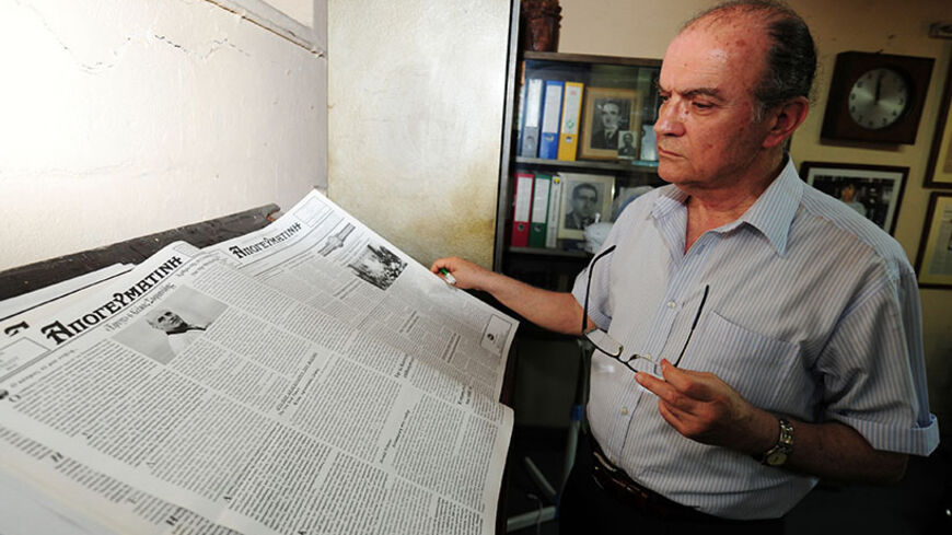 TO GO WITH AFP STORY IN FRENCH BY NICOLAS CHEVIRON:Greek crisis threatens minority newspaper in Istanbul
Mihail Vasiliadis, owner of the Apoyevmatini newspaper, poses during an interview with an AFP journalist at his office, in Istanbul, on July 12, 2011. Apoyevmatini, the main newspaper of the small Greek community of Istanbul, has survived the vagaries of Greek-Turkish relations for 86 years. It is now threatened with closure, as Greek companies cut advertising. AFP PHOTO / MUSTAFA OZER (Photo credit shou