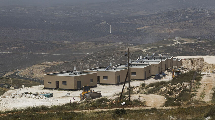 New prefabricated homes are seen in the West Bank Jewish settlement of Yitzhar, near Nablus May 7, 2014. Israeli lawmakers are pressing Prime Minister Benjamin Netanyahu to lift what they call unjustified secrecy over opaque - and rising - funding for settlements on West Bank land Palestinians want for a state. Picture taken May 7, 2014. REUTERS/Ronen Zvulun (WEST BANK - Tags: POLITICS BUSINESS EMPLOYMENT REAL ESTATE) - RTR3VEE5