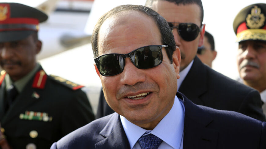 Egypt's President Abdel Fattah al-Sisi smiles upon arrival at Khartoum International Airport in Khartoum June 27, 2014. REUTERS/Mohamed Nureldin Abdallah (SUDAN - Tags: POLITICS) - RTR3W4IZ