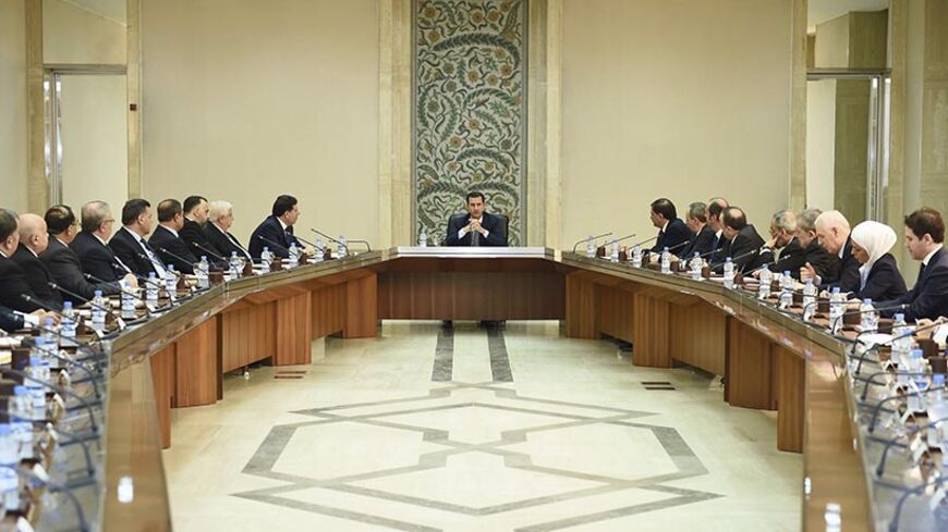 Syria's President Bashar al-Assad (C) heads a meeting of his new cabinet in Damascus August 31, 2014 in this picture released by Syria's national news agency SANA. REUTERS/SANA/Handout via Reuters (SYRIA - Tags: POLITICS CONFLICT CIVIL UNREST) ATTENTION EDITORS - THIS PICTURE WAS PROVIDED BY A THIRD PARTY. REUTERS IS UNABLE TO INDEPENDENTLY VERIFY THE AUTHENTICITY, CONTENT, LOCATION OR DATE OF THIS IMAGE. FOR EDITORIAL USE ONLY. NOT FOR SALE FOR MARKETING OR ADVERTISING CAMPAIGNS. THIS PICTURE IS DISTRIBUTE