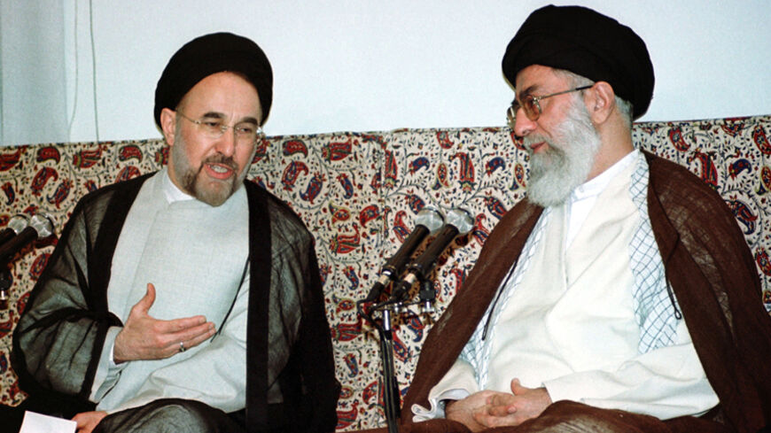 Iranian President Mohammad Khatami (L) makes a point to Iranian Supreme
Leader Ayatollah Ali Khamenei (R) as he introduces the new cabinet to
the Leader in Tehran August 27, 2001. Iran's reformist parliament
approved all 20 ministers nominated by President Mohammad Khatami
despite earlier misgivings the new cabinet would not do enough to bring
about rapid change. Khatami, re-elected with a landslide 77 percent of
the vote in June, had promised in his second four-year term to press
for a freer, but many refo