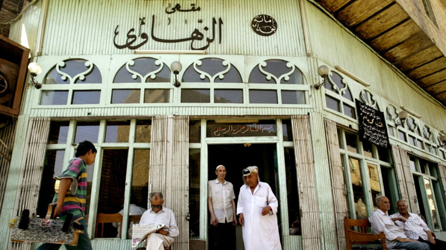General view of the famous Al-Zahawi cafe, a meeting point for intellectuals and bohemians of the Iraqi society at the beginning of the century, in central Baghdad June 5, 2003. [The city is struggling back to life more than seven weeks after U.S.-led forces toppled Saddam Hussein, but chaos still ensues. ] - RTXM0PV