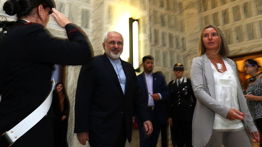 Italy's Foreign Minister Federica Mogherini (R) arrives for a news conference with her Iranian counterpart Mohammad Javad Zarif  (2nd L) during a meeting in Rome, September 3, 2014. 
REUTERS/Alessandro Bianchi (ITALY - Tags: POLITICS) - RTR44TAF