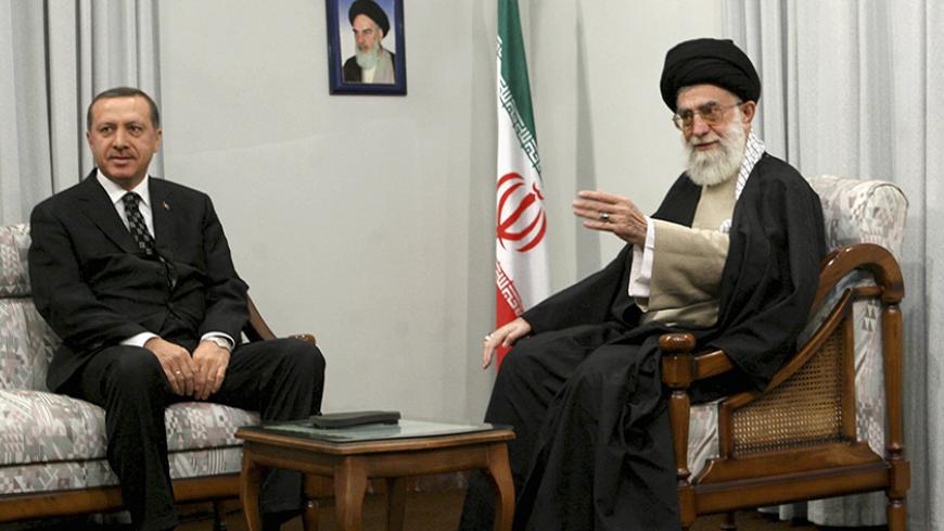Iran's Supreme Leader Ayatollah Ali Khamenei (R) speaks with Turkish officials while meeting Turkey's Prime Minister Tayyip Erdogan in Tehran December 3, 2006. REUTERS/ISNA (IRAN) - RTR1K0EK