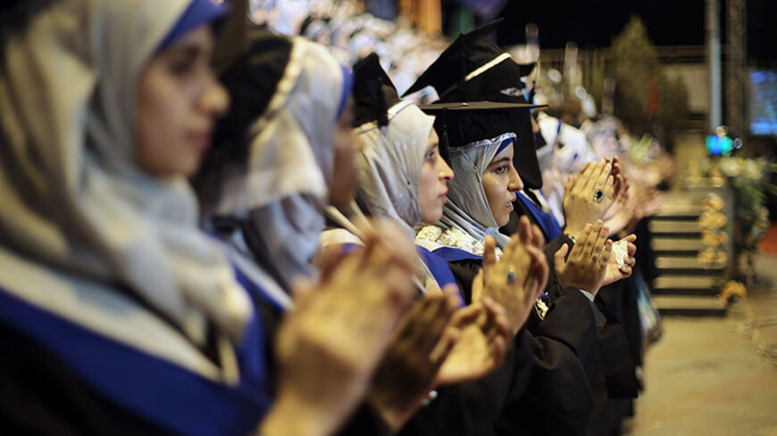 Palestinian students attend their graduation ceremony at the University College of Applied Sciences in Gaza City September 10, 2014. REUTERS/Ibraheem Abu Mustafa (GAZA - Tags: EDUCATION) - RTR45QL9