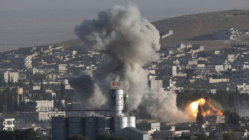 Smoke rises after an U.S.-led air strike in the Syrian town of Kobani Ocotber 10, 2014. Islamic State fighters advanced deeper into the Syrian town of Kobani on the Turkish border on Friday, taking almost complete control of an area where the local Kurdish administration is based, a group monitoring the violence reported.  REUTERS/Umit Bektas (SYRIA  - Tags: CIVIL UNREST MILITARY CONFLICT)   - RTR49OPT