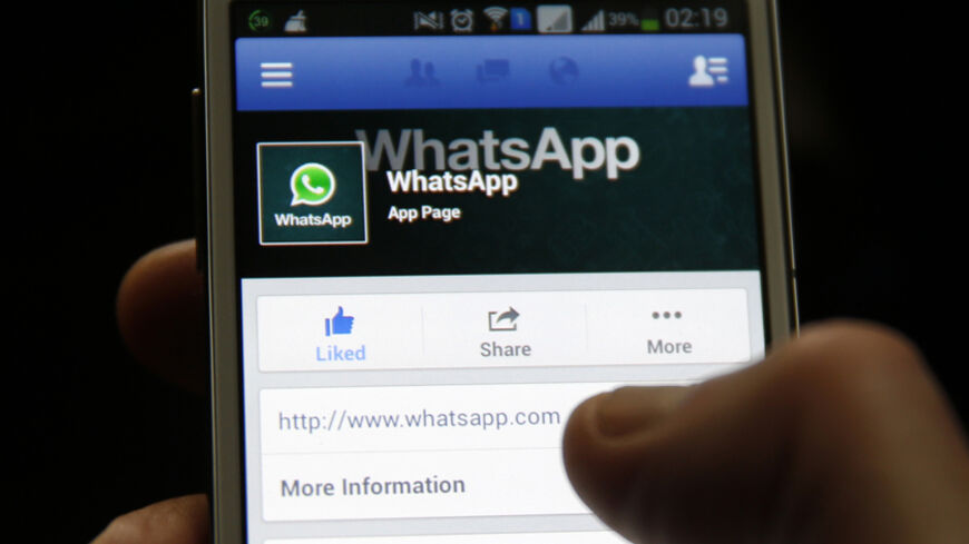 A Whatsapp App page is seen on Facebook on a Samsung Galaxy S4 phone in the central Bosnian town of Zenica, February 20, 2014. Facebook Inc will buy fast-growing mobile-messaging startup WhatsApp for $19 billion in cash and stock in a landmark deal that places the world's largest social network closer to the heart of mobile communications and may bring younger users into the fold. REUTERS/Dado Ruvic (BOSNIA AND HERZEGOVINA - Tags: BUSINESS) - RTX196E9