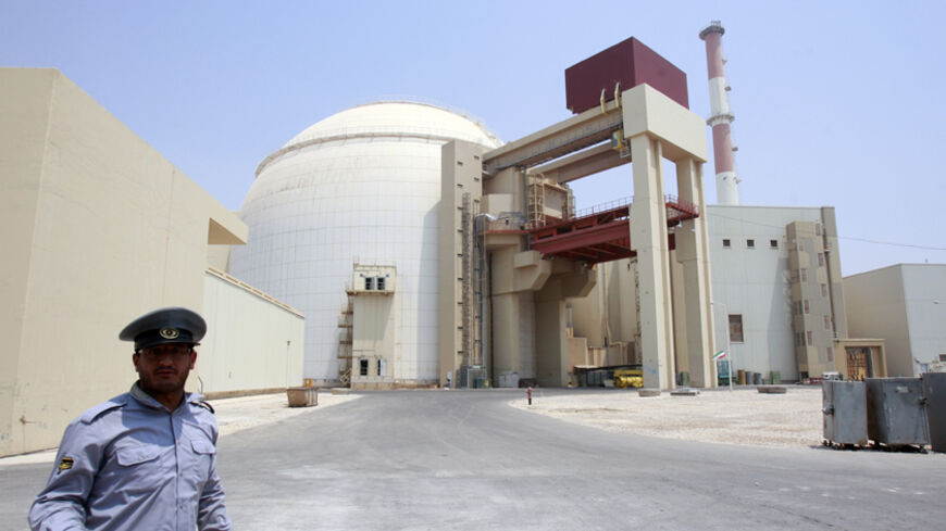 EDITORS' NOTE: Reuters and other foreign media are subject to Iranian restrictions on leaving the office to report, film or take pictures in Tehran.

A security official talks to journalists in front of Bushehr main nuclear reactor, 1,200 km (746 miles) south of Tehran, August 21, 2010. Iran began fuelling its first nuclear power plant on Saturday, a potent symbol of its growing regional sway and rejection of international sanctions designed to prevent it building a nuclear bomb.  REUTERS/Raheb Homavandi (I