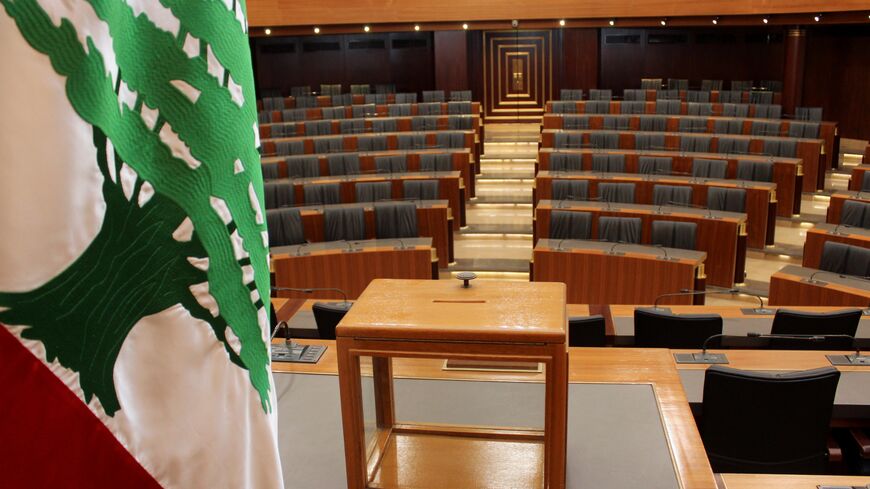 A ballot box sits on a table next to the national flag at the Lebanese Parliament in the capital Beirut on April 22, 2014 ahead of tomorrow's presidential election. Lebanon's parliament convenes tomorrow to try to elect a new president without a clear frontrunner in sight because of deep divisions over the Syrian conflict and Hezbollah's arsenal. AFP PHOTO / STR        (Photo credit should read -/AFP/Getty Images)