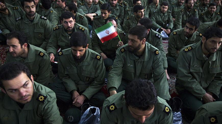 EDITORS' NOTE: Reuters and other foreign media are subject to Iranian restrictions on leaving the office to report, film or take pictures in Tehran.

Members of the revolutionary guard attend the anniversary ceremony of Iran's Islamic Revolution at the Khomeini shrine in the Behesht Zahra cemetery, south of Tehran, February 1, 2012. REUTERS/Raheb Homavandi  (IRAN - Tags: POLITICS ANNIVERSARY MILITARY) - RTR2X5DT