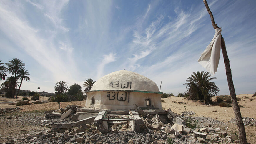 The remains of the Sheikh Zewaid shrine is seen after it was blown up by Islamist extremists following the revolution, at a graveyard in Sheikh Zewaid city, in north Sinai, March 7, 2012.  Islamist extremists who believe in the strict application of Islam blew up the Sheikh Zewaid tomb, a landmark shrine for one of the early Muslims to arrive in Egypt, after local Sufis who believe in the holiness of the Sheikh used to practice their rituals beside it.  To match Insight EGYPT-SINAI   Picture taken March 7, 