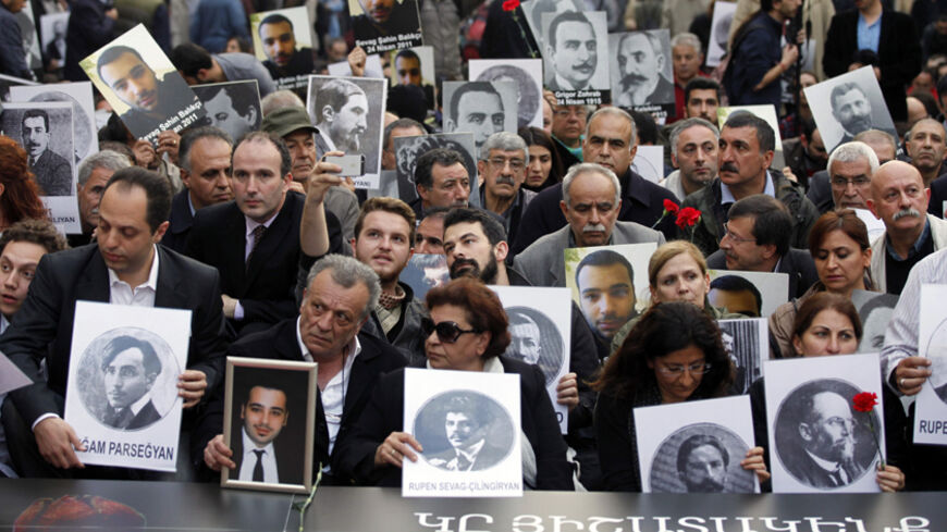 Activists hold pictures of Armenian victims during a demonstration to commemorate the 1915 mass killing of Armenians in the Ottoman Empire, in Istanbul April 24, 2014. Turkish Prime Minister Tayyip Erdogan offered on Wednesday what the government said were unprecedented condolences to the grandchildren of Armenians killed in World War One by Ottoman soldiers. In a statement issued on the eve of the 99th anniversary of the deeply contested deaths, Erdogan unexpectedly described the events of 1915 as "inhuman