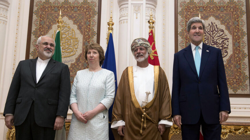 (L-R) Iranian Foreign Minister Javad Zarif, EU envoy Catherine Ashton, Omani Foreign Minister Yussef bin Alawi and U.S. Secretary of State John Kerry pose for a photo in Muscat November 9, 2014. Zarif began talks with Kerry and Ashton in Oman on Sunday to try to advance efforts to end a standoff over Tehran's nuclear program, a witness said. REUTERS/Nicholas Kamm/Pool (OMAN - Tags: POLITICS ENERGY) - RTR4DF4P