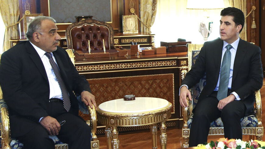 Iraq's Oil Minister, Adel Abdul-Mehdi (L) meets with Iraq's Kurdistan Prime Minister  Nechirvan Barzani in Arbil, north of Baghdad, November 13, 2014.   REUTERS/Stringer (IRAQ - Tags: POLITICS ENERGY) - RTR4E0S5