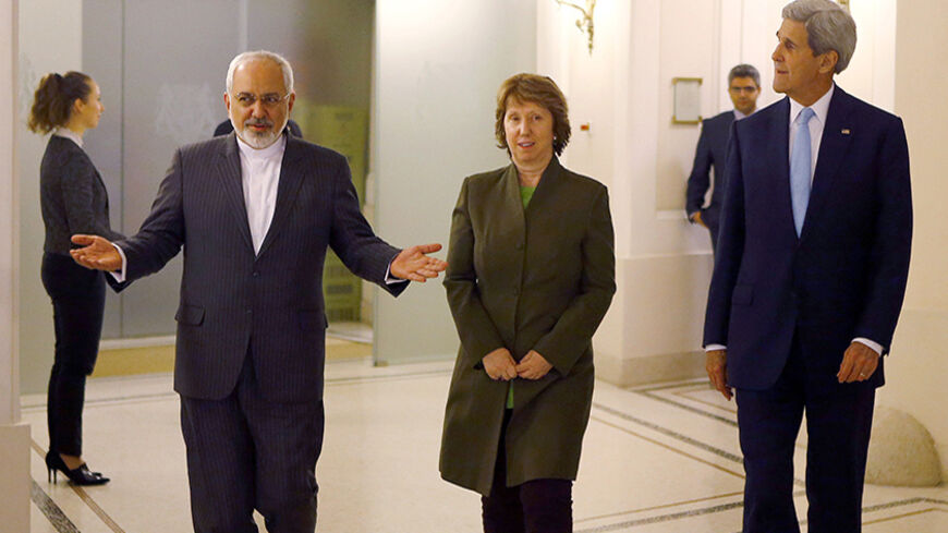 U.S. Secretary of State John Kerry (R), Iranian Foreign Minister Javad Zarif (L) and EU envoy Catherine Ashton arrive for a meeting in Vienna November 20, 2014. Tehran has yet to explain away allegations it conducted atomic bomb research, the head of the U.N. nuclear agency said on Thursday, four days before a deadline for Iran and six world powers to reach a deal on the Iranian nuclear programme. REUTERS/Leonhard Foeger (AUSTRIA - Tags: POLITICS ENERGY) - RTR4EXZO