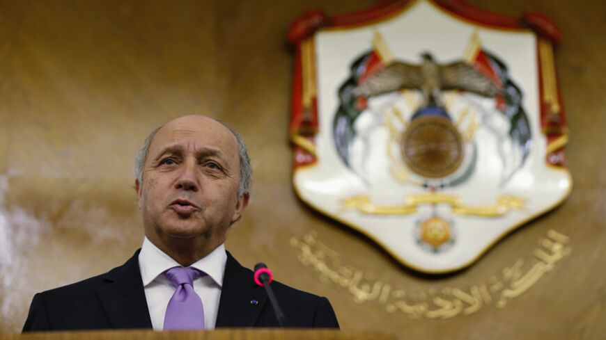 French Foreign Minister Laurent Fabius speaks during a joint news conference with his Jordanian counterpart Nasser Judeh at the Ministry of Foreign Affairs in Amman July 19, 2014. REUTERS/Muhammad Hamed (JORDAN - Tags: POLITICS) - RTR3ZC48