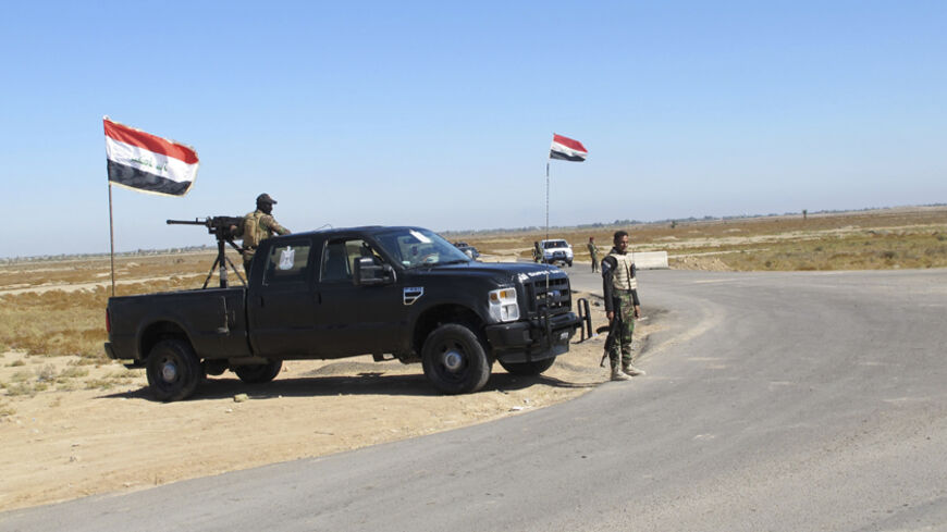 Iraqi security forces take part in an intensive security deployment against Islamic State militants in the town of Amriyat al-Falluja in Anbar province, November 5, 2014. Picture taken November 5, 2014.  REUTERS/Stringer (IRAQ - Tags: POLITICS CONFLICT MILITARY CIVIL UNREST) - RTR4D7BW