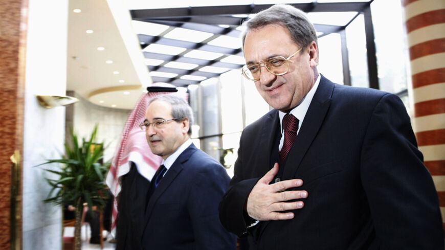 Russia's Deputy Foreign Minister Mikhail Bogdanov (R) walks with Syria's Deputy Foreign Minister Faisal al-Miqdad upon his arrival in Damascus December 10, 2014.
REUTERS/Omar Sanadiki   (SYRIA - Tags: POLITICS) - RTR4HEWY