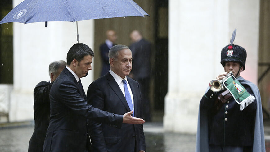 Italy's Prime Minister Matteo Renzi (L) gestures to his Israeli counterpart  Benjamin Netanyahu during a meeting at Chigi Palace in Rome December 15, 2014. REUTERS/Yara Nardi (ITALY - Tags: POLITICS) - RTR4I29B