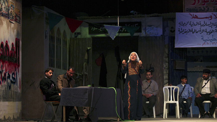 Palestinian artists perform at al-Shawa theatre in Gaza City March 9, 2010. Live theatre is rare in the Gaza Strip; public criticism of its Islamist rulers is rare too. So perhaps it was no surprise that a play which gives vent to Palestinians' frustrations with their leaders should be a hit. Picture taken March 9, 2010. To match Reuters Life! PALESTINIANS-GAZA/THEATRE   REUTERS/Suhaib Salem (GAZA - Tags: ENTERTAINMENT POLITICS SOCIETY) - RTR2BXPS