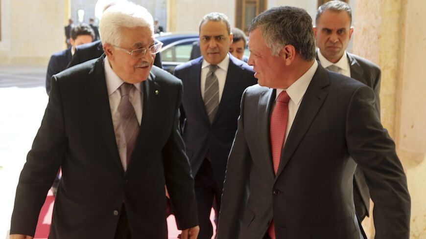 Jordan's King Abdullah (R) welcomes Palestinian President Mahmoud Abbas at the Royal Palace in Amman July 24, 2014. REUTERS/Yousef Allan/Royal Palace/Handout via Reuters (JORDAN - Tags: POLITICS ROYALS) ATTENTION EDITORS - THIS PICTURE WAS PROVIDED BY A THIRD PARTY. REUTERS IS UNABLE TO INDEPENDENTLY VERIFY THE AUTHENTICITY, CONTENT, LOCATION OR DATE OF THIS IMAGE. FOR EDITORIAL USE ONLY. NOT FOR SALE FOR MARKETING OR ADVERTISING CAMPAIGNS. THIS PICTURE IS DISTRIBUTED EXACTLY AS RECEIVED BY REUTERS, AS A SE