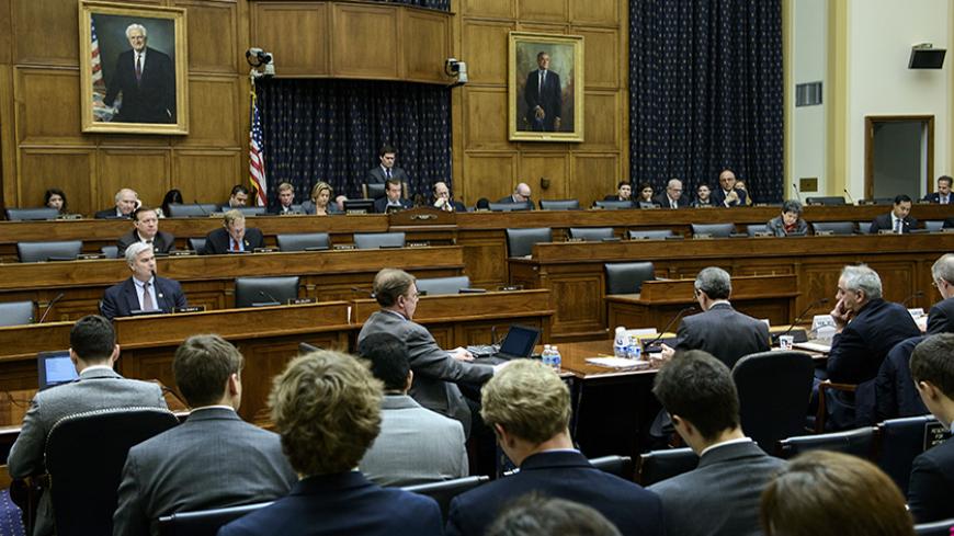 People listen during a hearing of the House Foreign Affairs Committee January 27, 2015 in Washington, DC.  The committee held the hearing on negotiations with Iran on their nuclear program. AFP PHOTO/BRENDAN SMIALOWSKI        (Photo credit should read BRENDAN SMIALOWSKI/AFP/Getty Images)