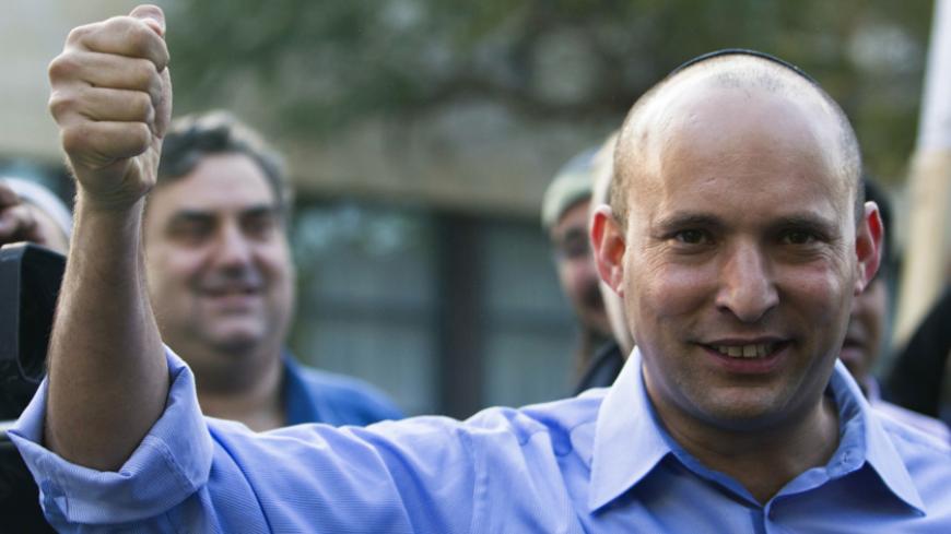 Naftali Bennett, leader of the Bayit Yehudi party, gestures after casting his vote for the parliamentary election at a polling station in Raanana, near Tel Aviv January 22, 2013. Israelis voted on Tuesday in an election widely expected to win Prime Minister Benjamin Netanyahu a third term in office, pushing the Jewish State further to the right, away from peace with Palestinians and towards a showdown with Iran. REUTERS/Nir Elias (ISRAEL - Tags: POLITICS ELECTIONS) - RTR3CS5X