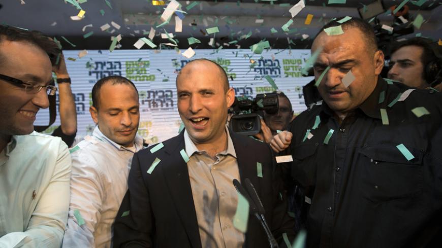 Head of the Bayit Yehudi party Naftali Bennett (C) celebrates at his party's headquarters in Ramat Gan, near Tel Aviv January 22, 2013. Hawkish Prime Minister Benjamin Netanyahu emerged the bruised winner of Israel's election on Tuesday, claiming victory despite unexpected losses to resurgent centre-left challengers. Netanyahu has traditionally looked to religious, conservative parties for backing and is widely expected to seek out self-made millionaire Bennett, who heads the Jewish Home party and stole muc