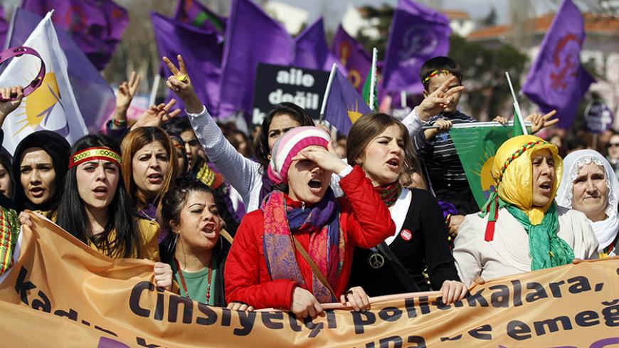 Women walk as they shout slogans during a rally calling for gender equality, two days after International Women's Day, in Istanbul March 10, 2013. REUTERS/Osman Orsal (TURKEY - Tags: POLITICS CIVIL UNREST) - RTR3ET3V