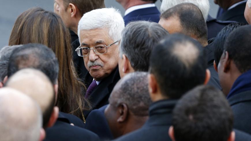 Palestinian President Mahmoud Abbas (C) takes part with dozens of foreign leaders in a solidarity march (Marche Republicaine) in the streets of Paris January 11, 2015. Hundreds of thousands of French citizens will be joined by dozens of foreign leaders, among them Arab and Muslim representatives, in a march on Sunday in an unprecedented tribute to this week's victims,  including journalists and policemen, following the shootings by gunmen at the offices of the satirical weekly newspaper Charlie Hebdo, the k