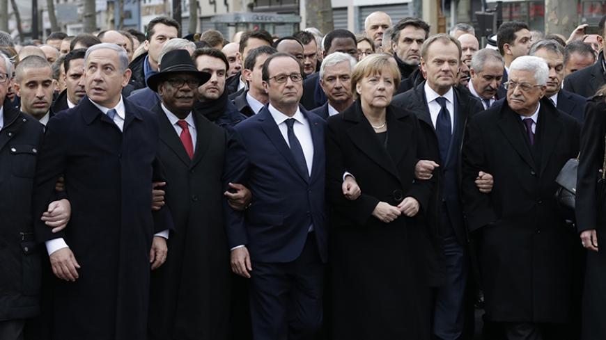 French President Francois Hollande is surrounded by Heads of state including (LtoR) Israel's Prime Minister Benjamin Netanyahu, Mali's President Ibrahim Boubacar Keita, Germany's Chancellor Angela Merkel, European Council President Donald Tusk and Palestinian President Mahmoud Abbas as they attend the solidarity march (Marche Republicaine) in the streets of Paris January 11, 2015. French citizens will be joined by dozens of foreign leaders, among them Arab and Muslim representatives, in a march on Sunday in