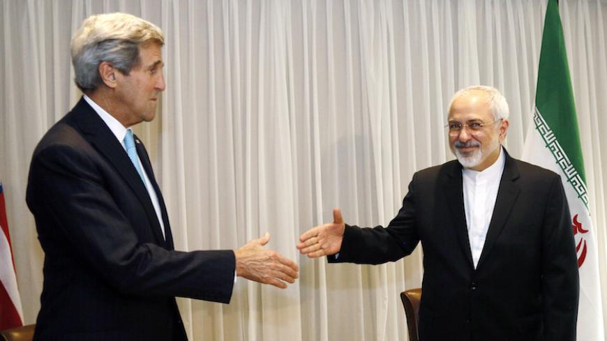 U.S. Secretary of State John Kerry shakes hands with Iranian Foreign Minister Mohammad Javad Zarif before a meeting in Geneva January 14, 2015. Zarif said on Wednesday that his meeting with Kerry was important to see if progress could be made in narrowing differences on his country's disputed nuclear program.  REUTERS/Rick Wilking (SWITZERLAND - Tags: POLITICS) - RTR4LDZW