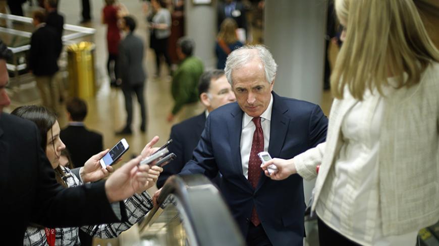 U.S. Senator Bob Corker (R-TN) speaks with reporters as he arrives for the weekly Senate Republican caucus luncheon at the U.S. Capitol in Washington February 10, 2015. REUTERS/Jonathan Ernst  (UNITED STATES - Tags: POLITICS) - RTR4P2GJ