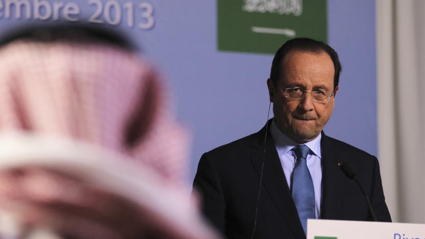 French President Francois Hollande attends a news conference in Riyadh December 29, 2013. France will supply weapons to the Lebanese army if it is asked to do so, French President Hollande said on Sunday during a visit to Saudi Arabia where he met King Abdullah. REUTERS/Stringer (SAUDI ARABIA - Tags: POLITICS) - RTX16WOP