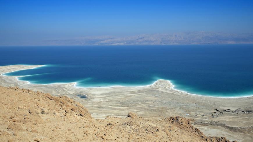 A picture taken on February 8, 2014 near Ein Gedi, in Israel shows the Dead Sea shoreline shaped by the decline in water levels as a result of the drying up. The Dead Sea, 400 meters below sea level, is the lowest point on earth and its mineral-rich waters and shores have been celebrated for their cleansing, healing and therapeutic properties. In the background is the Jordanian coast.   AFP PHOTO  THOMAS COEX        (Photo credit should read THOMAS COEX/AFP/Getty Images)