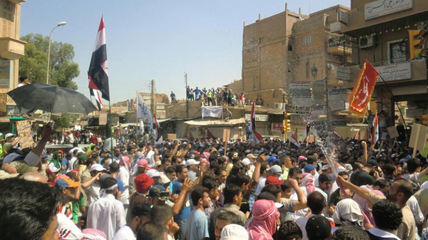 People take part in a protest against President Bashar al-Assad in the tribal province of Deir al-Zor, eastern Syria, July 22, 2011. Hundreds of thousands of people took to the streets across Syria after Friday prayers, activists and witnesses say, in widening pro-democracy protests against a violent military crackdown to crush a four month uprising.   REUTERS/Handout (SYRIA - Tags: POLITICS CIVIL UNREST) FOR EDITORIAL USE ONLY. NOT FOR SALE FOR MARKETING OR ADVERTISING CAMPAIGNS. THIS IMAGE HAS BEEN SUPPLI
