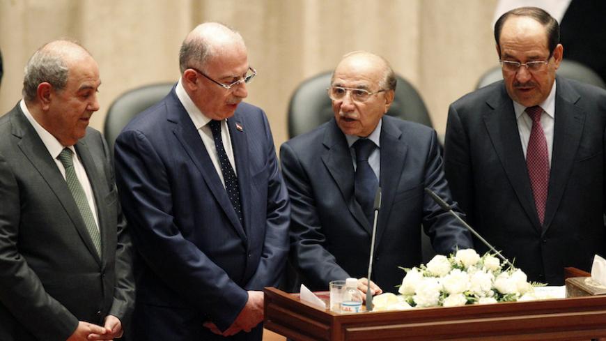 Iyad Allawi (L), Usama al-Nujaifi (2nd L), Iraq's supreme court judge Midhat al-Mahmoud (2nd R) and Nuri al-Maliki (R) stand together during a swearing-in at the parliament headquarters in Baghdad September 8, 2014. Iraq's parliament approved a new government headed by Haider al-Abadi as prime minister on Monday night, in a bid to rescue Iraq from collapse, with sectarianism and Arab-Kurdish tensions on the rise. The parliament approved for the ceremonial posts of vice presidents the last prime minister al-