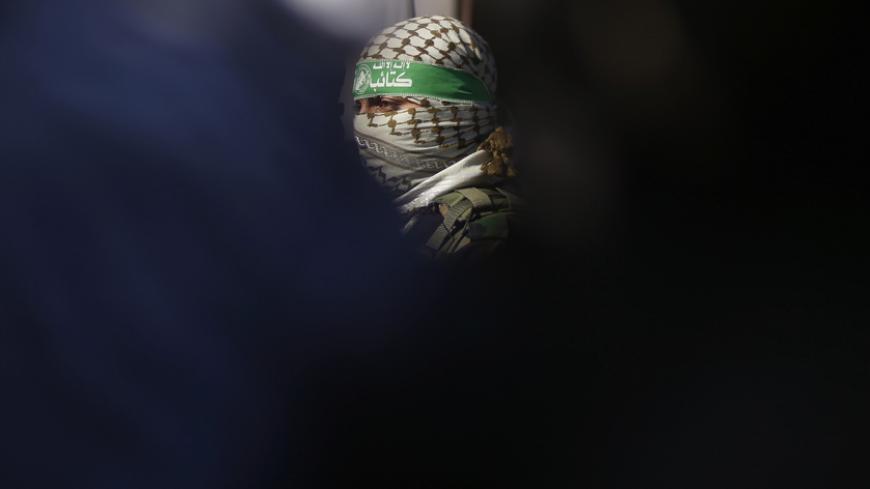 A Palestinian militant of Hamas' armed wing takes part in a news conference with other representatives of various Palestinian armed factions to condemn the decision of an Egyptian court that banned Hamas' armed wing, in Gaza City February 5, 2015. An Egyptian court last week banned Hamas' armed wing and listed it as a terrorist organization, prompting Hamas to reject Egypt as a mediator between Israel and the Palestinians, a role it has played for decades. 
REUTERS/Suhaib Salem (GAZA - Tags: POLITICS MILITA