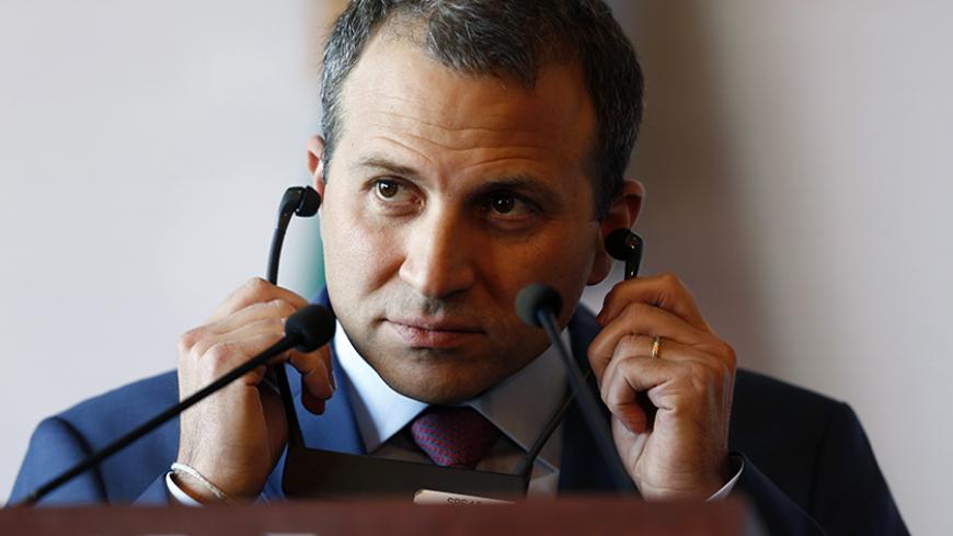 Lebanon's Foreign Minister Gebran Bassil adjusts his earpiece during a news conference at the Foreign Affairs building in Mexico City, February 23, 2015. REUTERS/Edgard Garrido (MEXICO - Tags: POLITICS) - RTR4QVGR