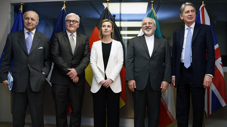 France's Foreign Minister Laurent Fabius (L-R), Germany's Foreign Minister Frank-Walter Steinmeier, European Union foreign policy chief Federica Mogherini, Iran's Foreign Minister Mohammad Javad Zarif and British Foreign Secretary Philip Hammond pose ahead of nuclear talks in Brussels March 16, 2015. REUTERS/Francois Lenoir (BELGIUM - Tags: POLITICS ENERGY) - RTR4TL7X