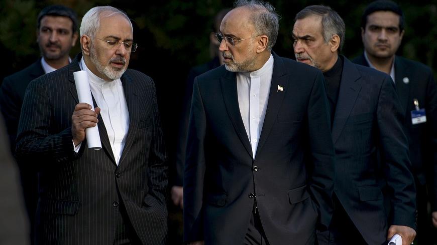 Iranian Foreign Minister Javad Zarif (L) talks with Head of the Iranian Atomic Energy Organization Ali Akbar Salehi after an afternoon meeting with U.S. Secretary of State John Kerry and U.S. officials at the Beau Rivage Palace Hotel in Lausanne March 27, 2015. 
Major powers and Iran were pushing each other for concessions on Friday ahead of an end-March deadline for a preliminary nuclear deal, with Tehran demanding an immediate end to sanctions and freedom to continue sensitive atomic research, officials s
