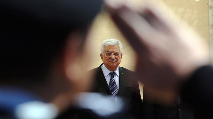 Palestinian president Mahmud Abbas looks on during an opening ceremony of the "Istiqlal" (independence) garden in the West Bank city of Ramallah on April 5, 2015. In his speech Abbas called for "a solution to protect" the 18,000 Palestinian refugees still trapped in the Yarmouk camp, south of Damascus, besieged by the Syrian regime and almost entirely in the hands of jihadists. AFP PHOTO / ABBAS MOMANI        (Photo credit should read ABBAS MOMANI/AFP/Getty Images)